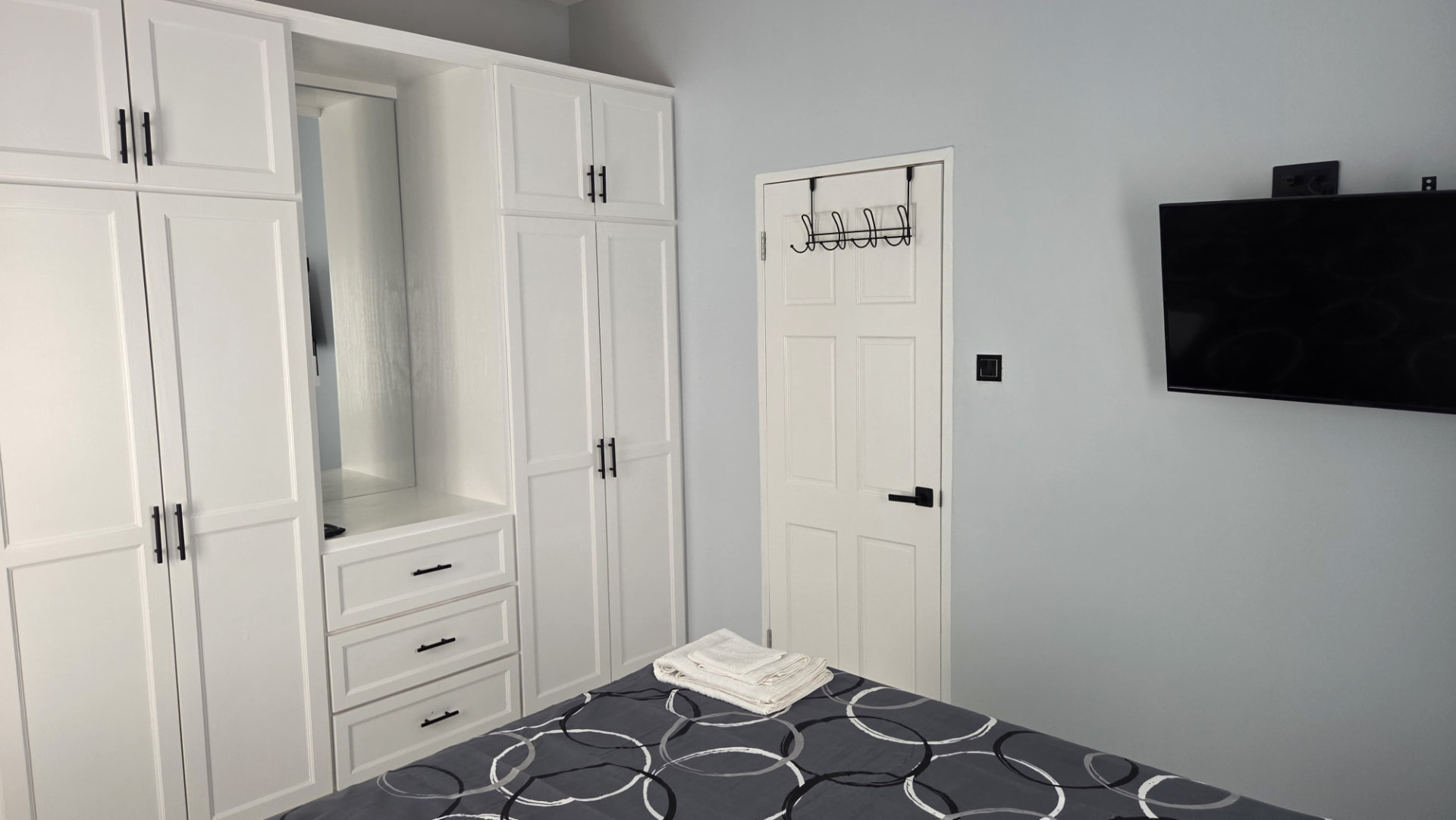 Wardrobe wall unit with bedroom smart TV
